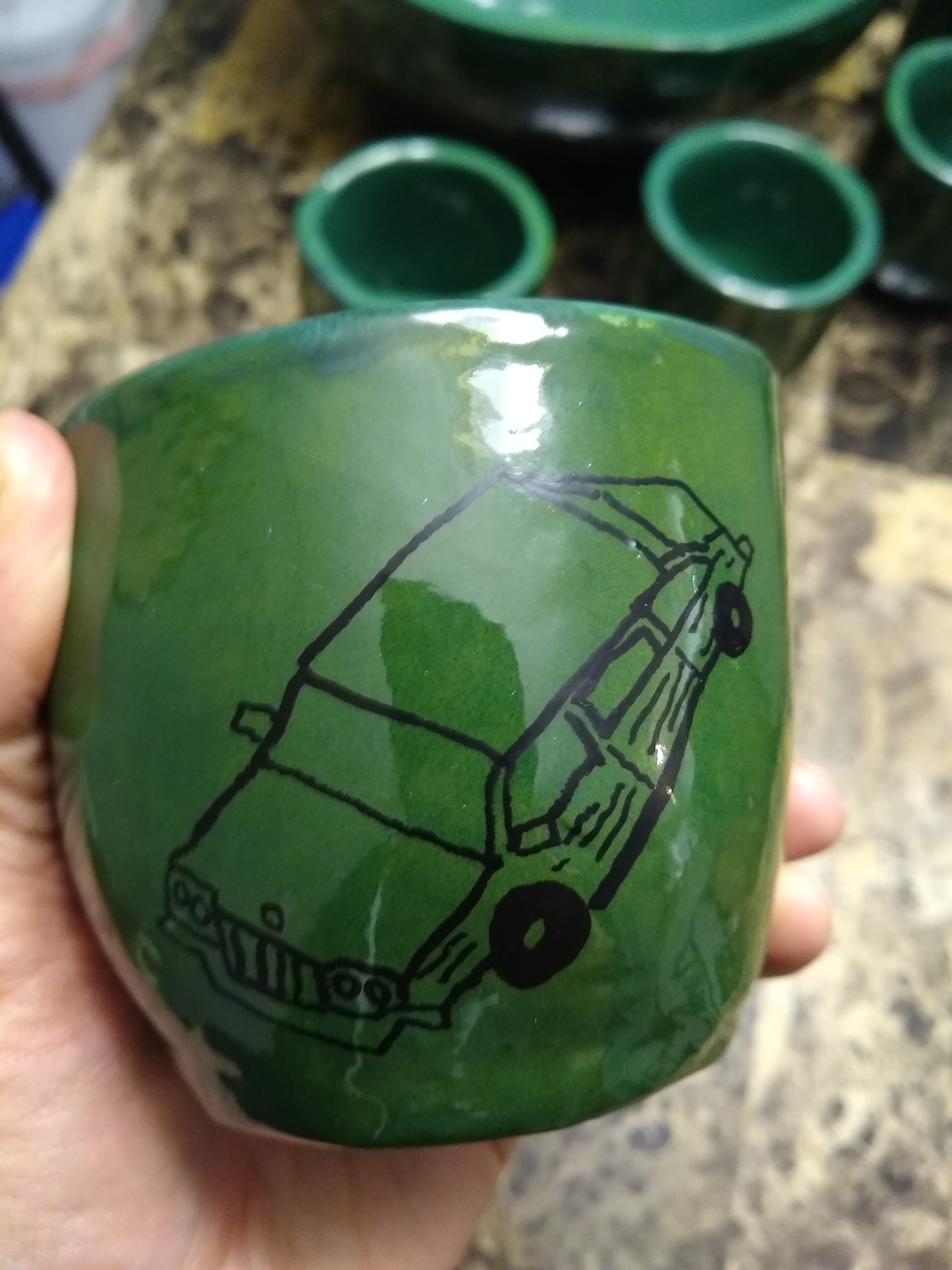 mug with a badly drawn car on it. god, it is awful